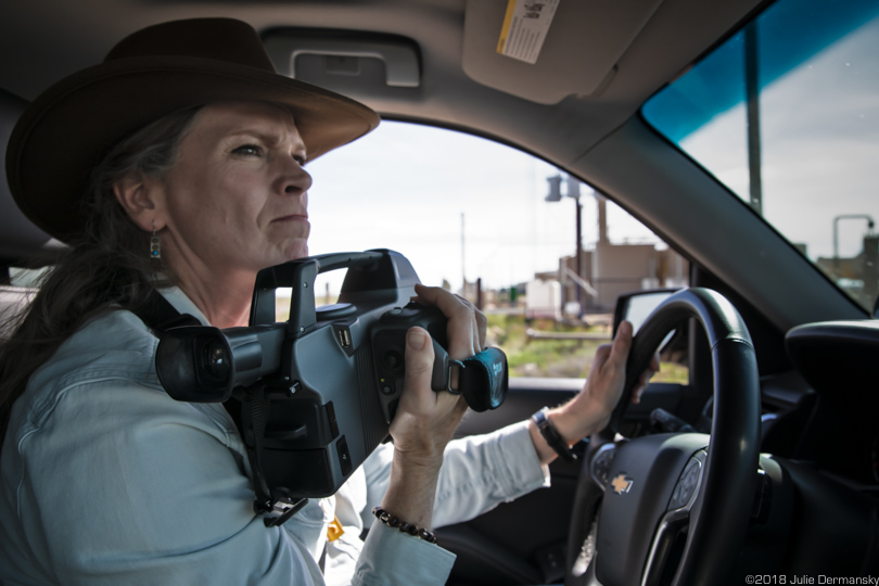 Sharon Wilson driving around the Permian Basin with her FLIR camera documenting pollution at oil and gas sites.