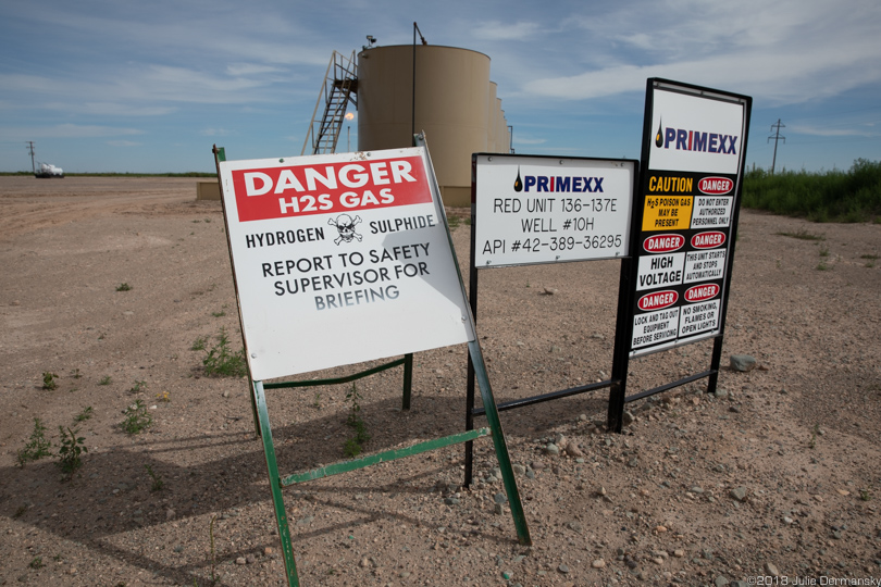 Hydrogen sulphide warning sign at a fracking site in the Permian Basin