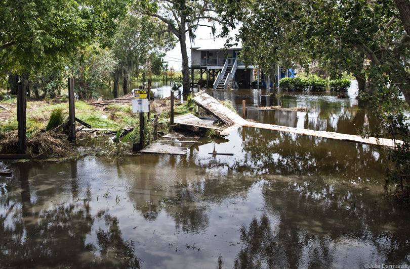 A destroyed bridge to a flooded home on Isle de Jean Charles