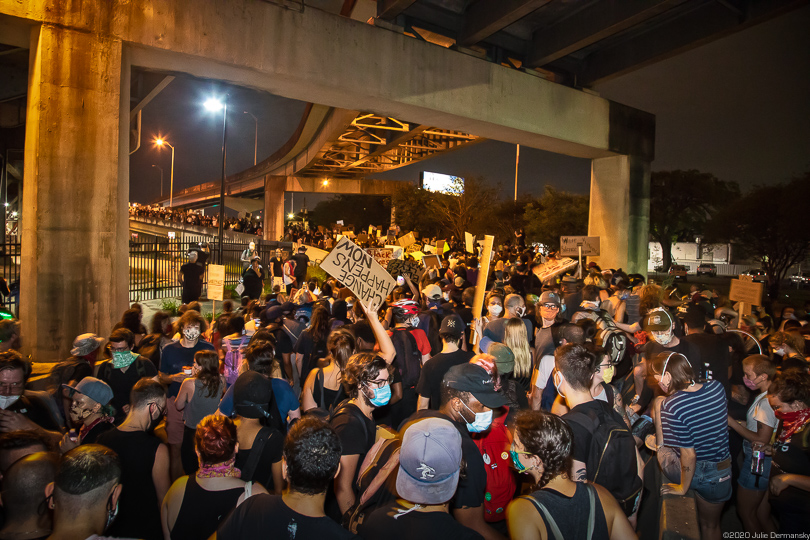 Protesters in New Orleans head onto the Crescent City Connection bridge June 3