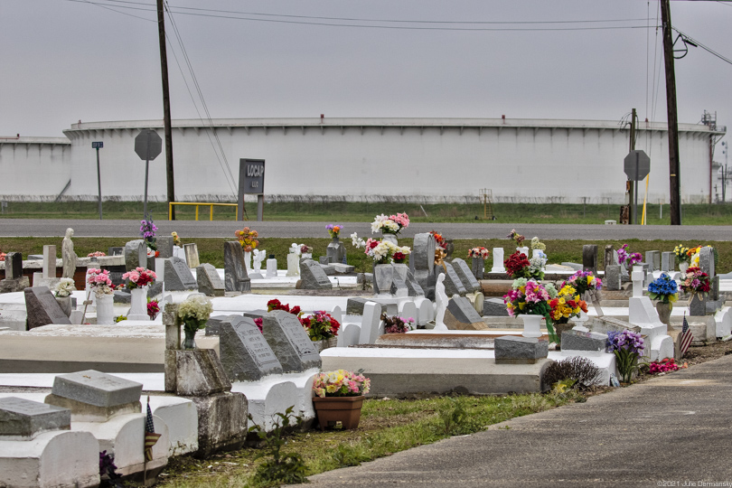 Cemetery in St. James, across from LOCAP oil storage tanks. 