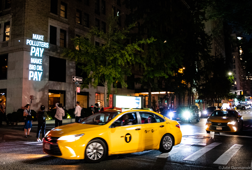 Anti-fossil fuel messages projected on the Gramercy Park Hotel in New York