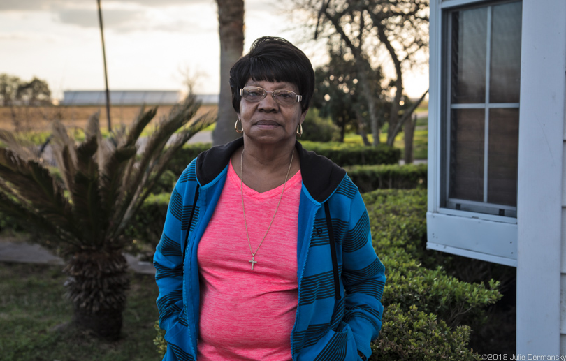 Geraldine Mayho in front of her home in St. James