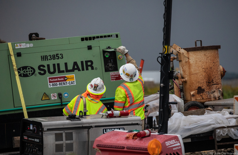 Bayou Bridge pipeline construction workers in a light rain