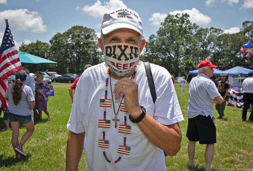 The only man wearing a face mask at a "save America" rally on July 4