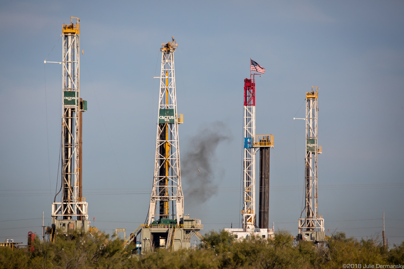 Four drilling rigs off the highway in Midland, Texas
