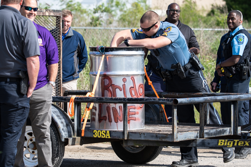 Police officer removing the protest barrel