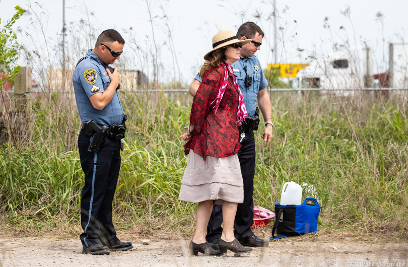 Susan Prevost is led away by two police officers