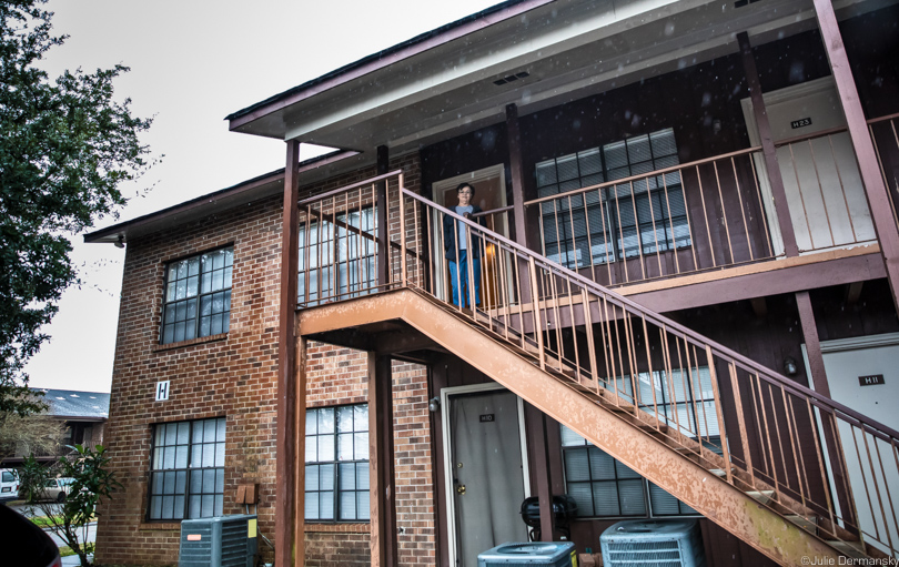 Rita Falgout in front of her apartment in Houma, provided by a state transitional housing program.