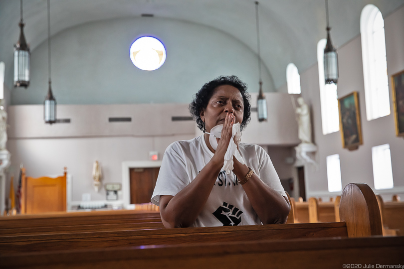 Sharon Lavigne prays in St. James Catholic Church