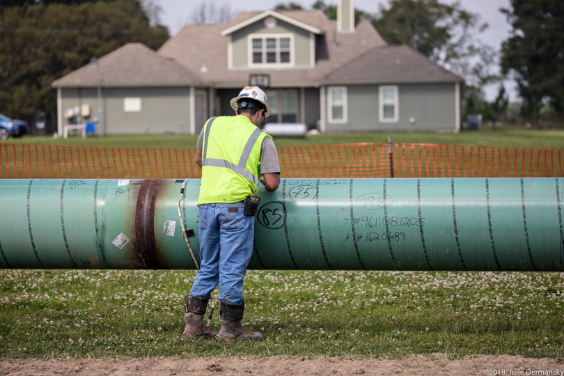 A construction working installing the Bayou Bridge pipeline on Hope Rosinski's land
