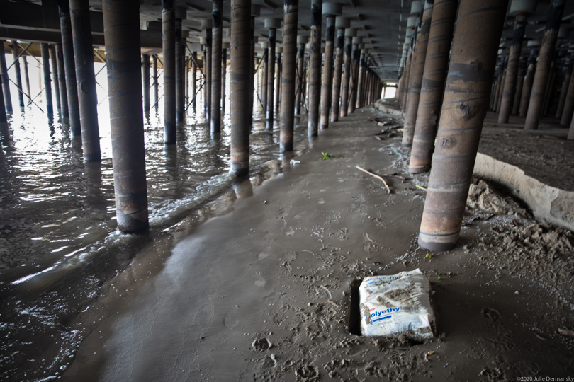 Dow Chemical bag of nurdles washed up under a wharf on the Mississippi River in New Orleans.