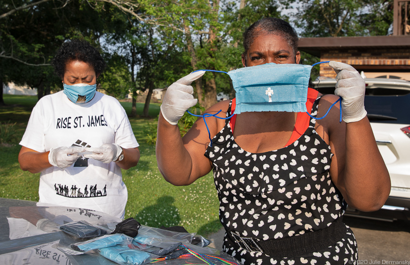 Sharon Lavigne, left, and Stephanie Cooper, right, with home-made masks