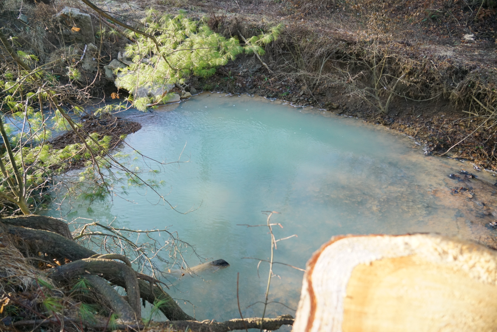 Strage blue waters in Wolf Run Creek in Ohio