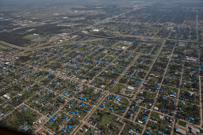 Blue tarps cover dozens of damaged houses near Lake Charles after Hurricane Delta.