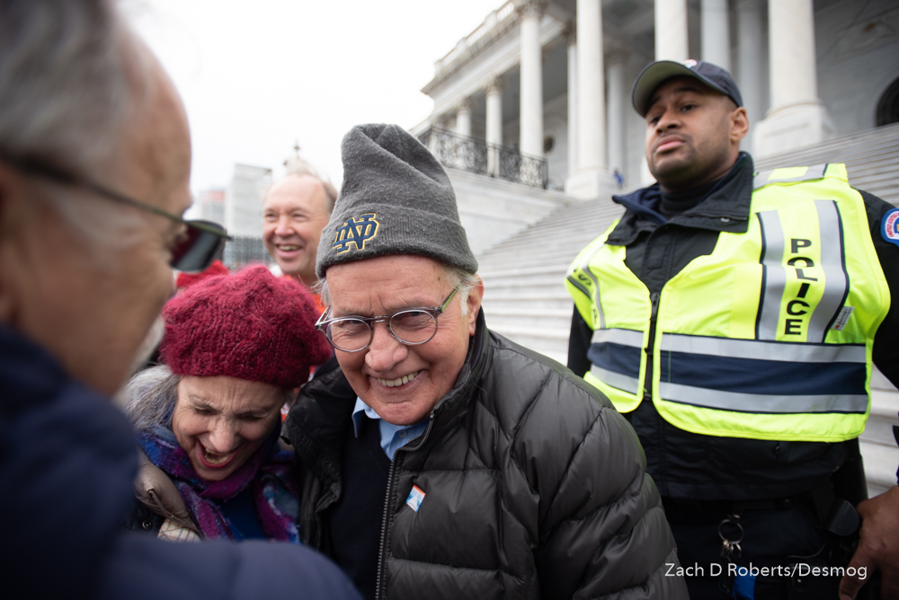 Actor Martin Sheen laughing with fans as Capitol Police approach