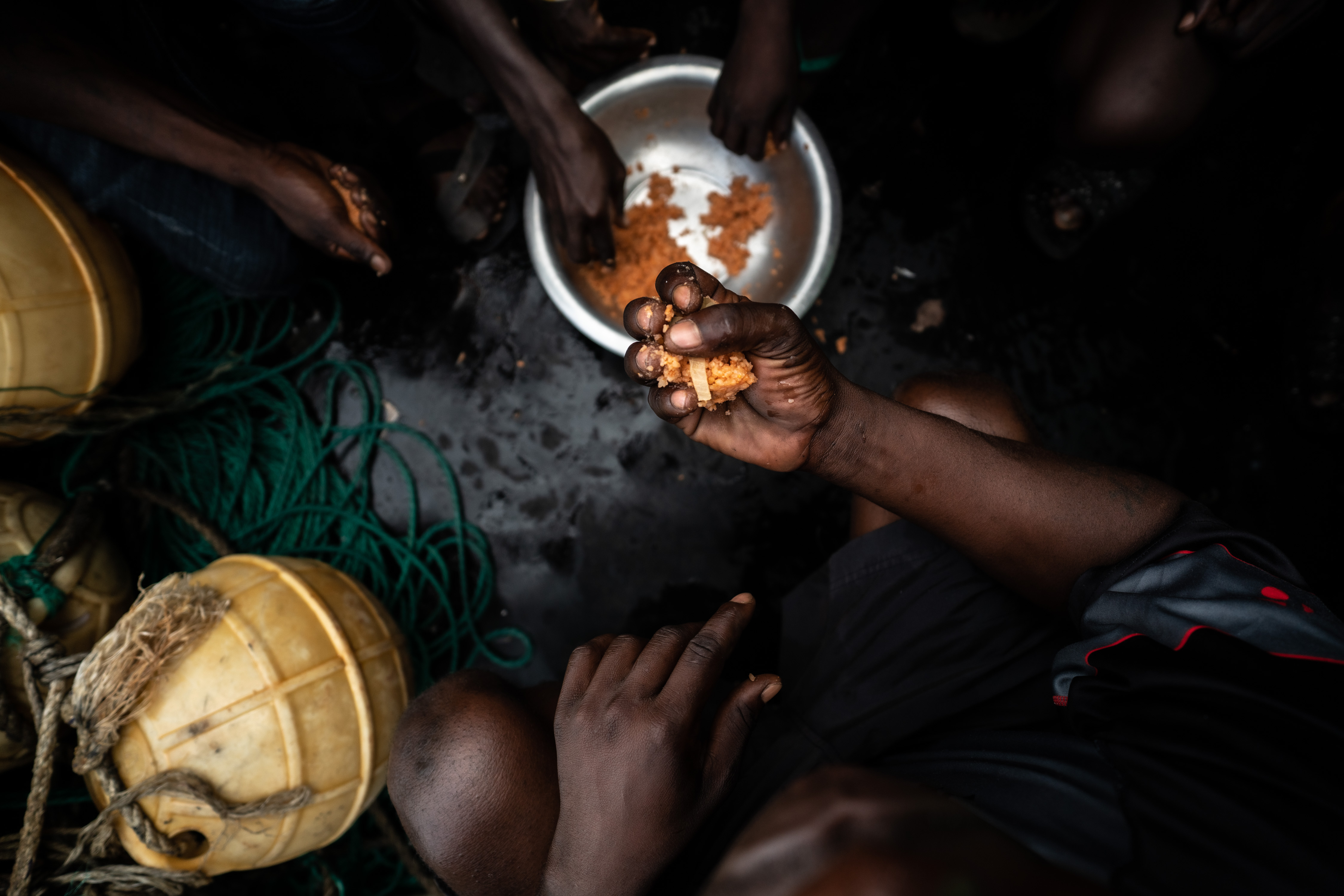 Hands holding fishmeal