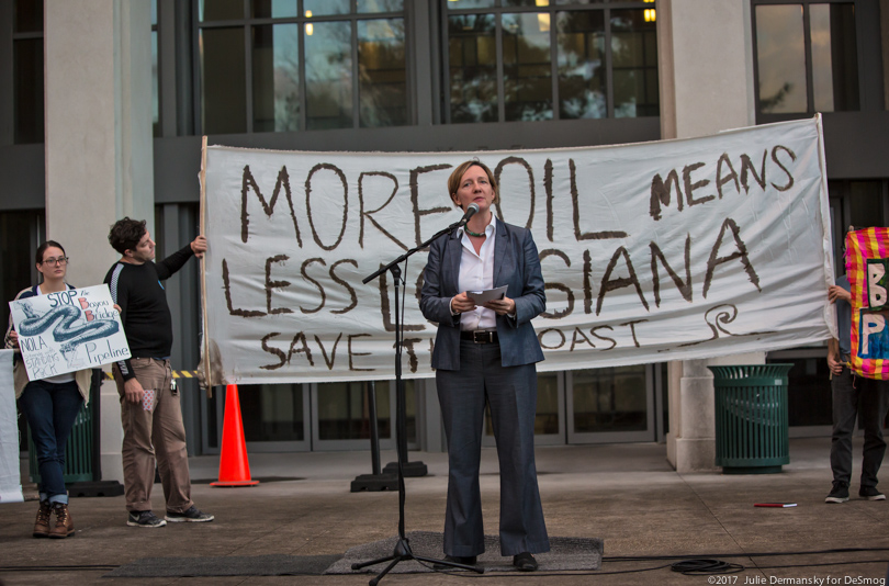 Anne Rolfes speaks on stage at a rally against the Bayou Bridge pipeline