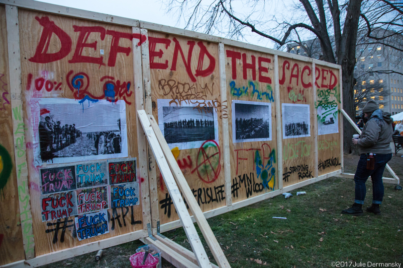 Mural in support of Standing Rock painted and taped to a temporary wood wall