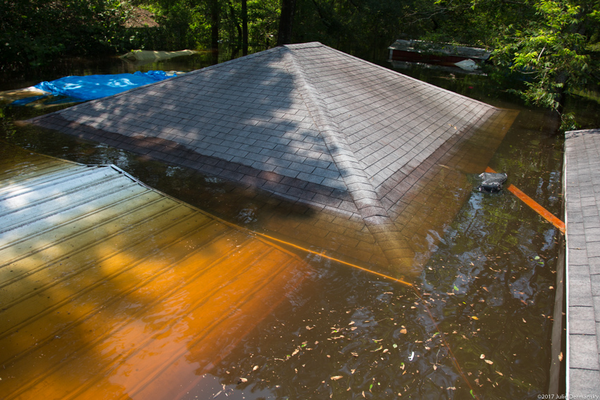 A home in Texas flooded up to its roof after Hurricane Harvey