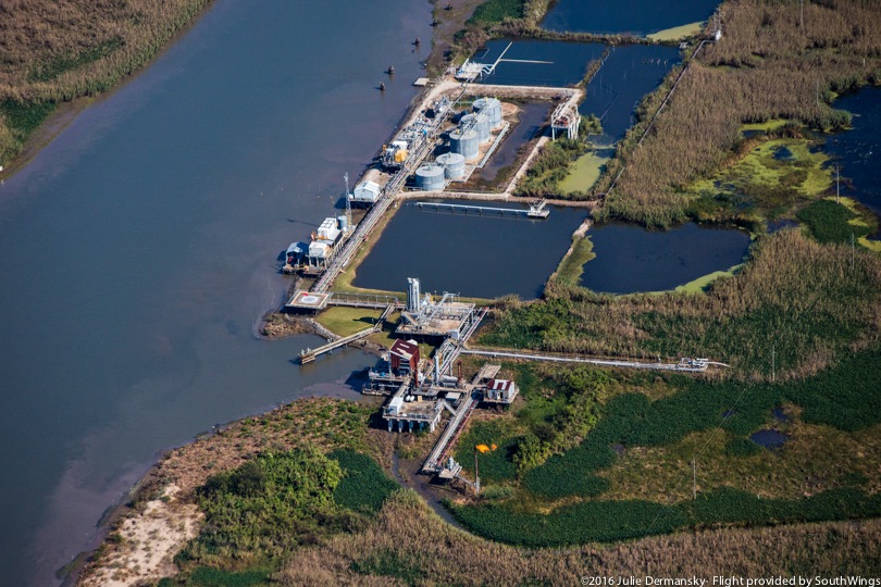 A natural gas flare visible at an oil and gas facility along the coast of Plaquemines Parish.