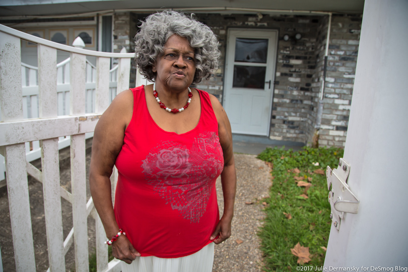 Geraldine Watkins stands outside her house