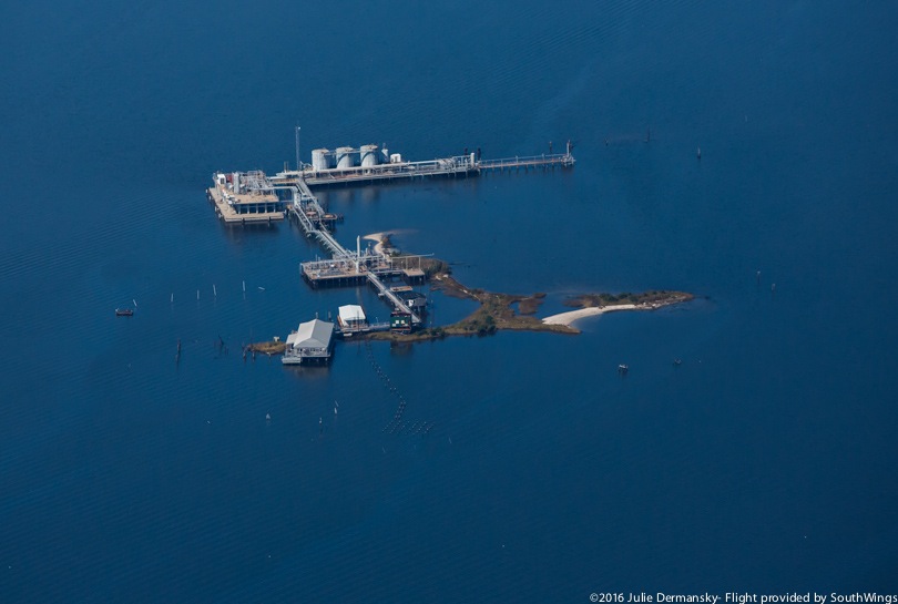 Oil and gas facility on the water and scarce coastal land of Plaquemines Parish.