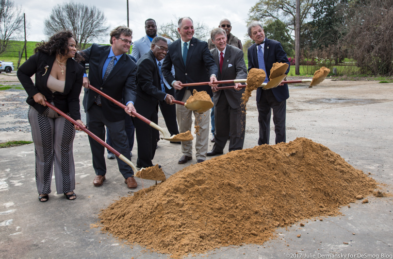 Louisiana Governor John Bell Edwards and other state and local officials hold golden shovels
