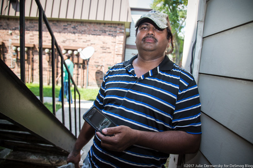 Jonathan Moraes stands outside his damaged rental unit