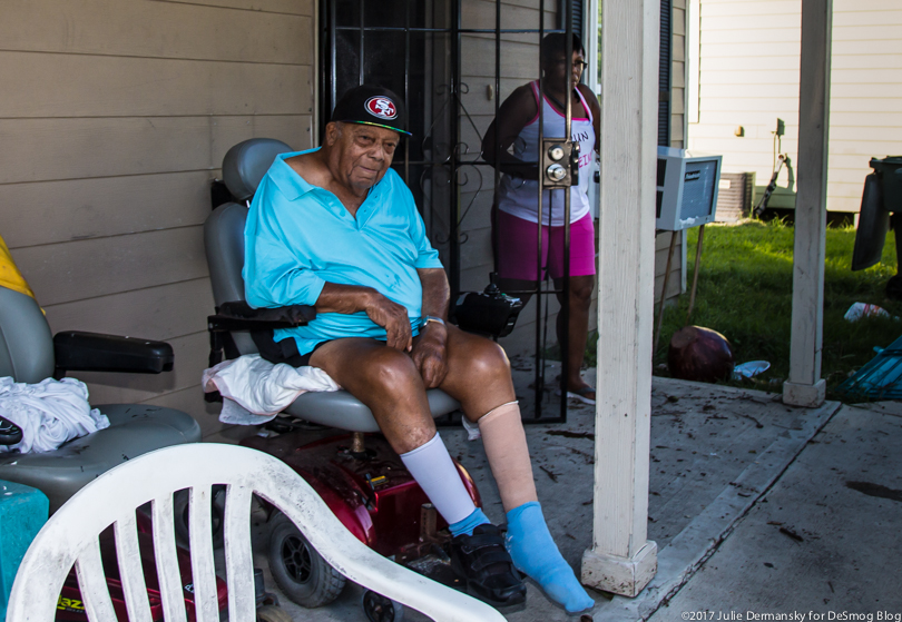 Marie Kelley and her grandfather outside his flooded home