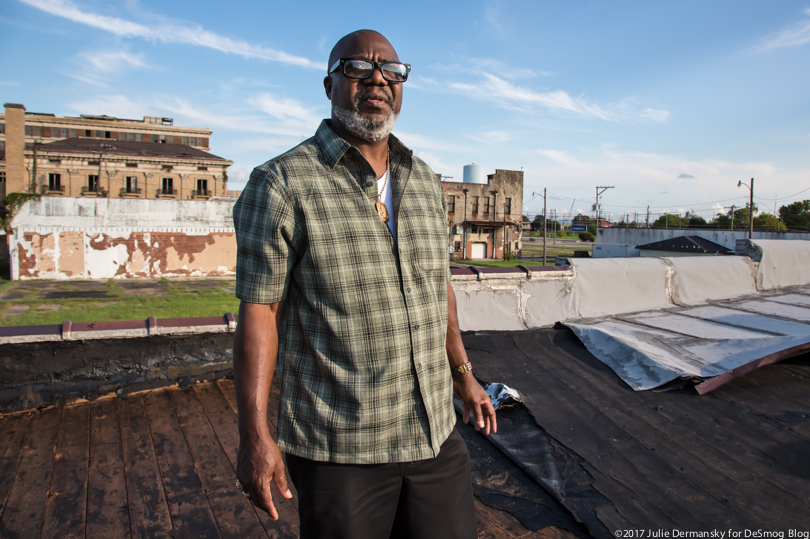 Hilton Kelley on the damaged roof of his restaurant in Port Arthur