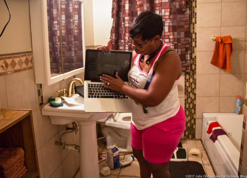 Marie Kelley finds water running out of her laptop computer