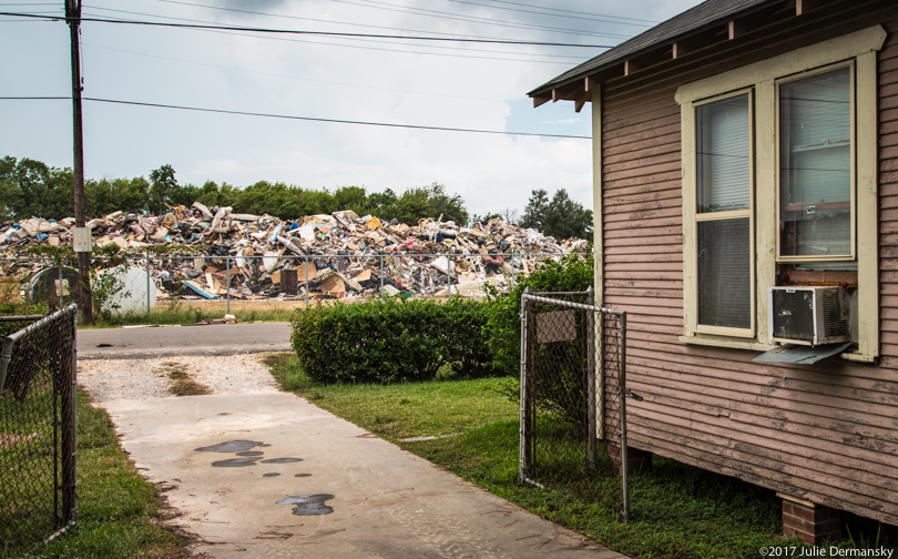 A house across the street from a temporary dump for hurricane debris in Port Arthur