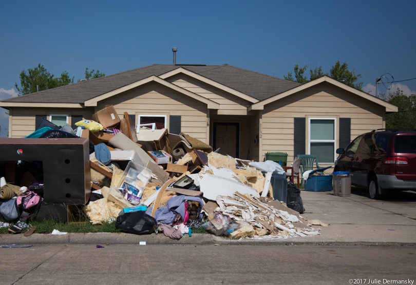 More storm debris outside a home flooded by Hurricane Harvey