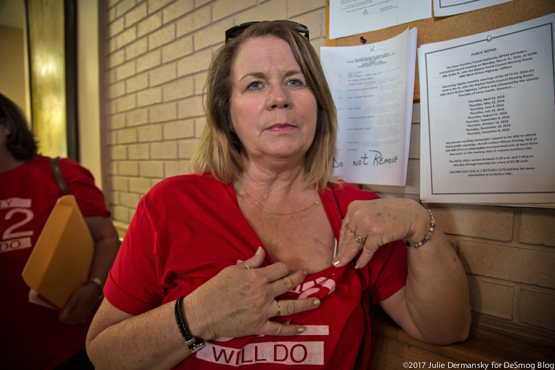 Kellie Tabb shows a scar on her chest from an operation that removed a tumor from her lung.