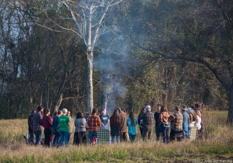 A circle of people participate in blessing land in the path of the Bayou Bridge pipeline in Rayne, Louisiana
