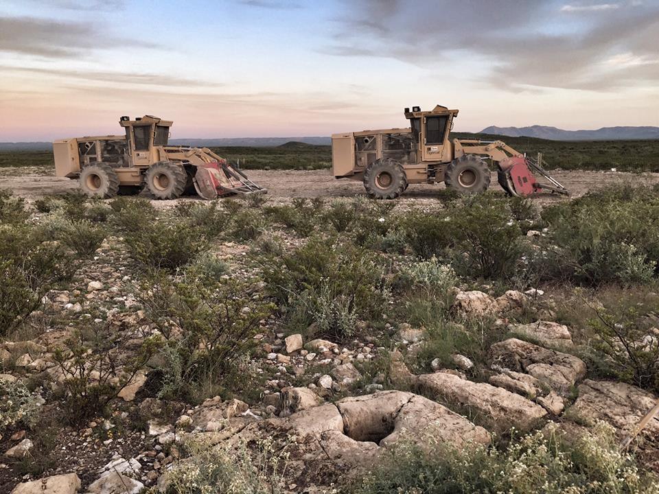 Construction equipment sits idle in the West Texas desert