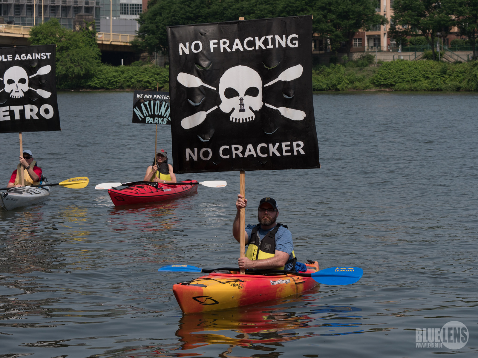 Protesers in kayaks with signs against fracking and cracker plants