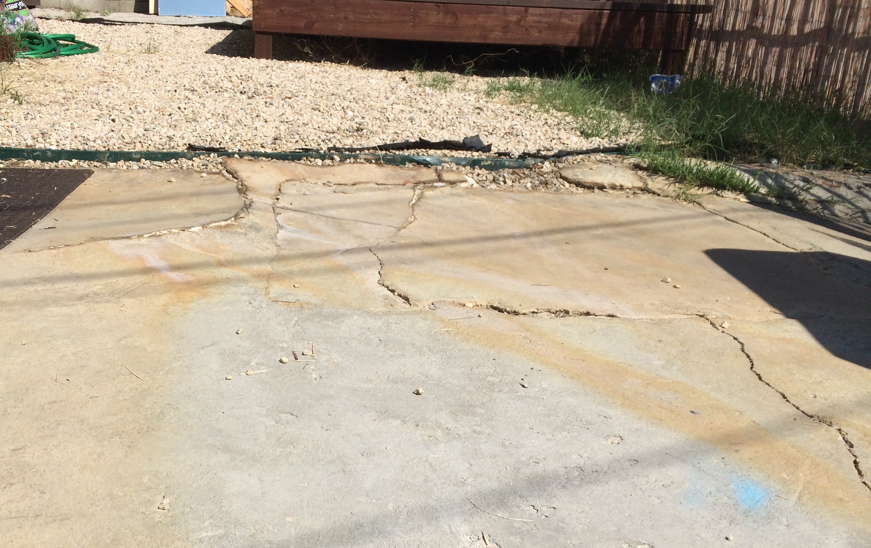 Stained and corroded cement in the front yard of Roger Majano's property on Firmin Street