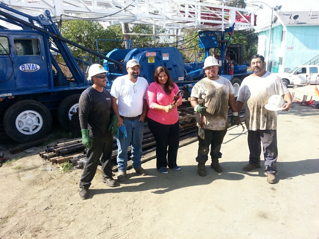 Rosalinda Morales with the workers capping the Patel 1 oil well on Firmin Street
