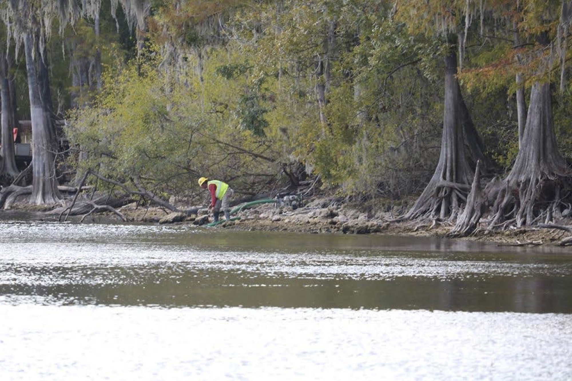 Sabal Trail worker pumps water from a river.