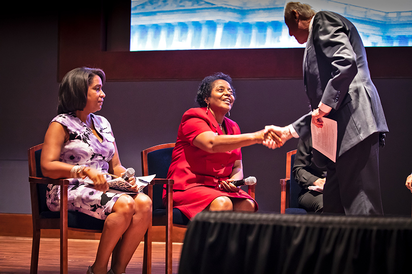 Sharon Lavigne shakes hands with House Majority Leader Steny Hoyer in June 2019