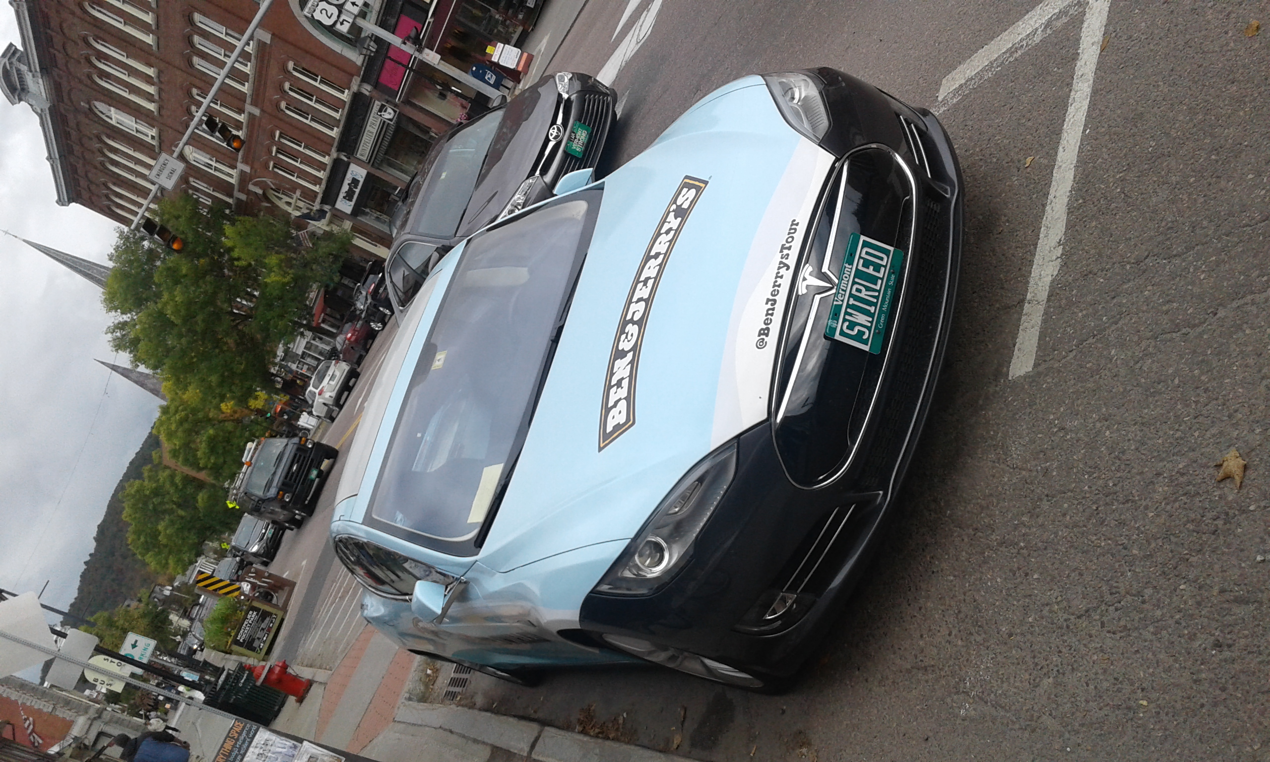 A Tesla Model S with Ben & Jerry's logo