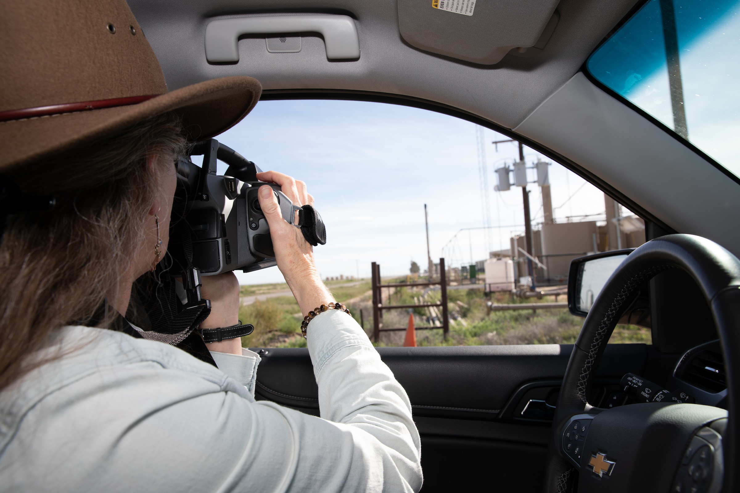 Sharon Wilson, Texas coordinator of Earthworks, with an optical gas imaging FLIR camera in the Permian Basin