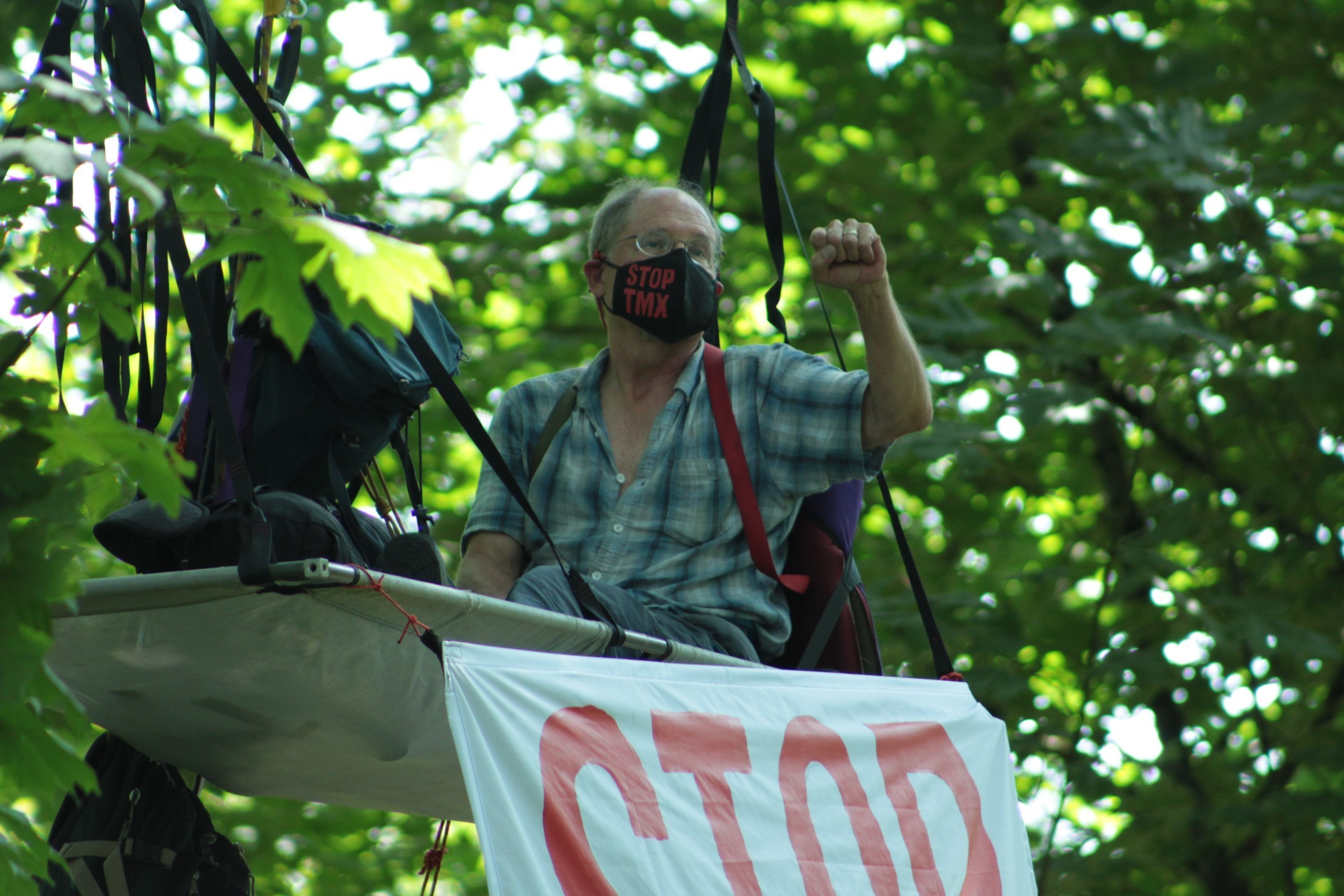 Physician Tim Takaro in an aerial camp protesting the Trans Mountain pipeline expansion