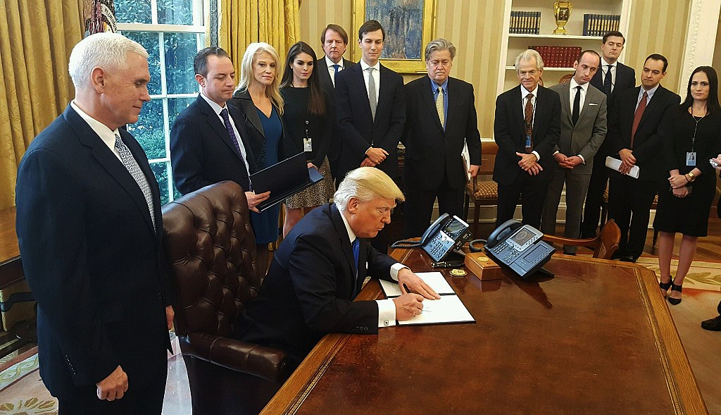 President Trump signs order greenlighting KXL and DAPL, while surrounded by Pence, Bannon, Conway, Kushner, others in Oval Office