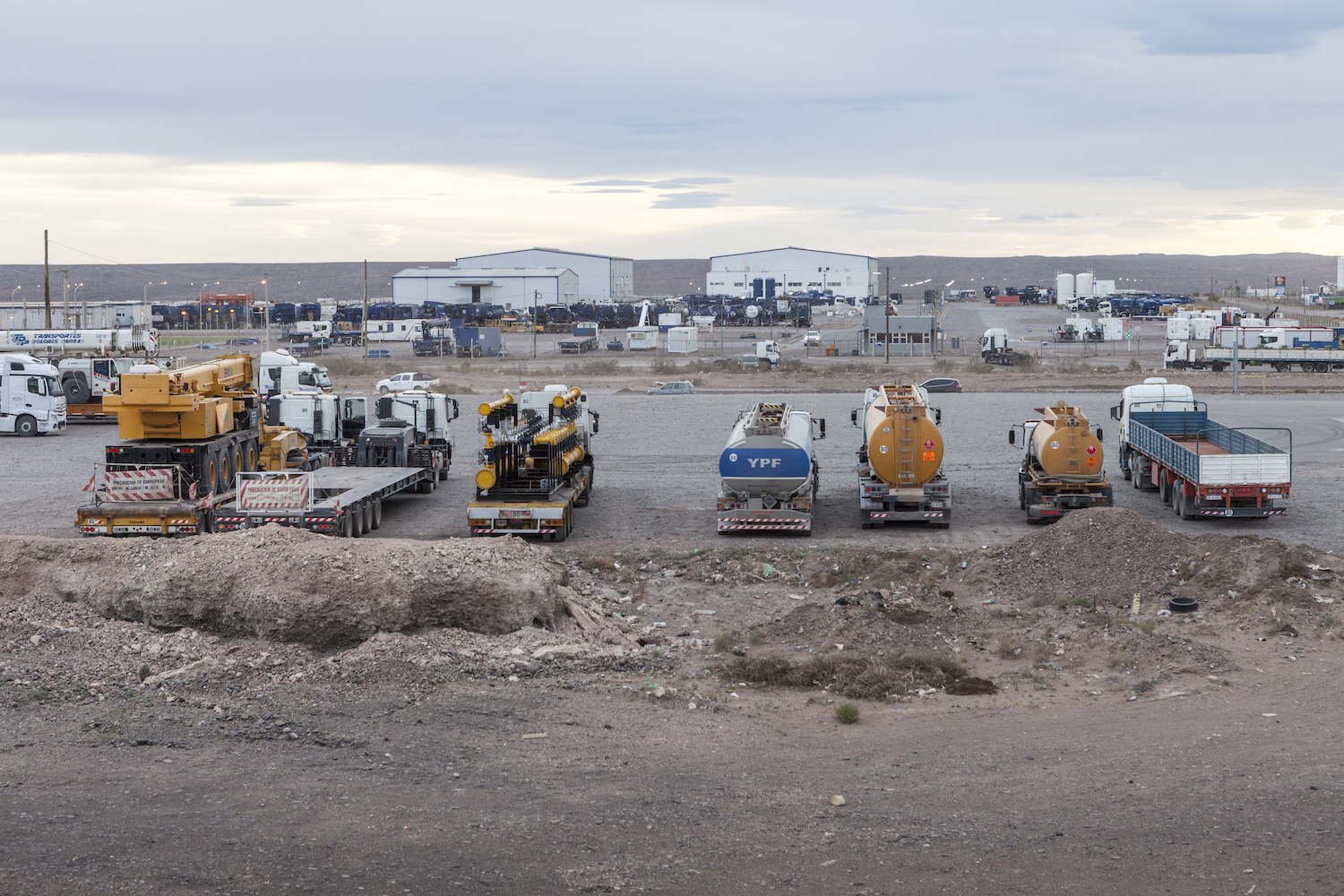 Industry trucks at a gas station near the Vaca Muerta shale