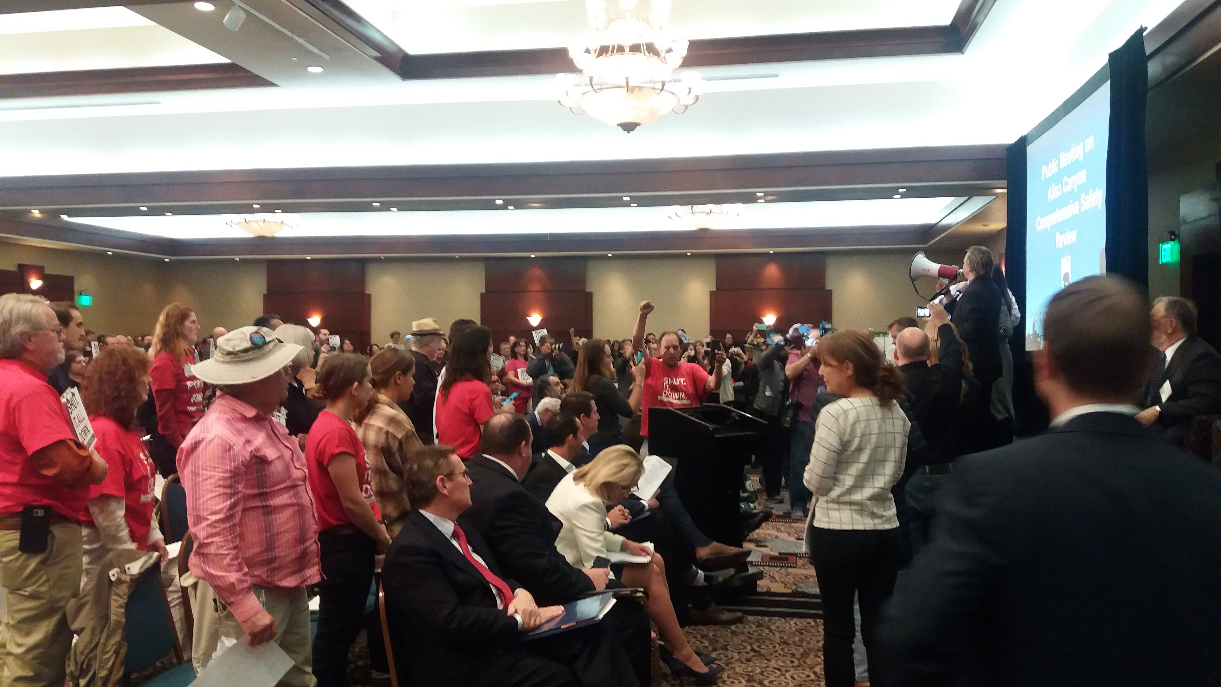 Protesters shut down the Aliso Canyon hearing using a bullhorn.