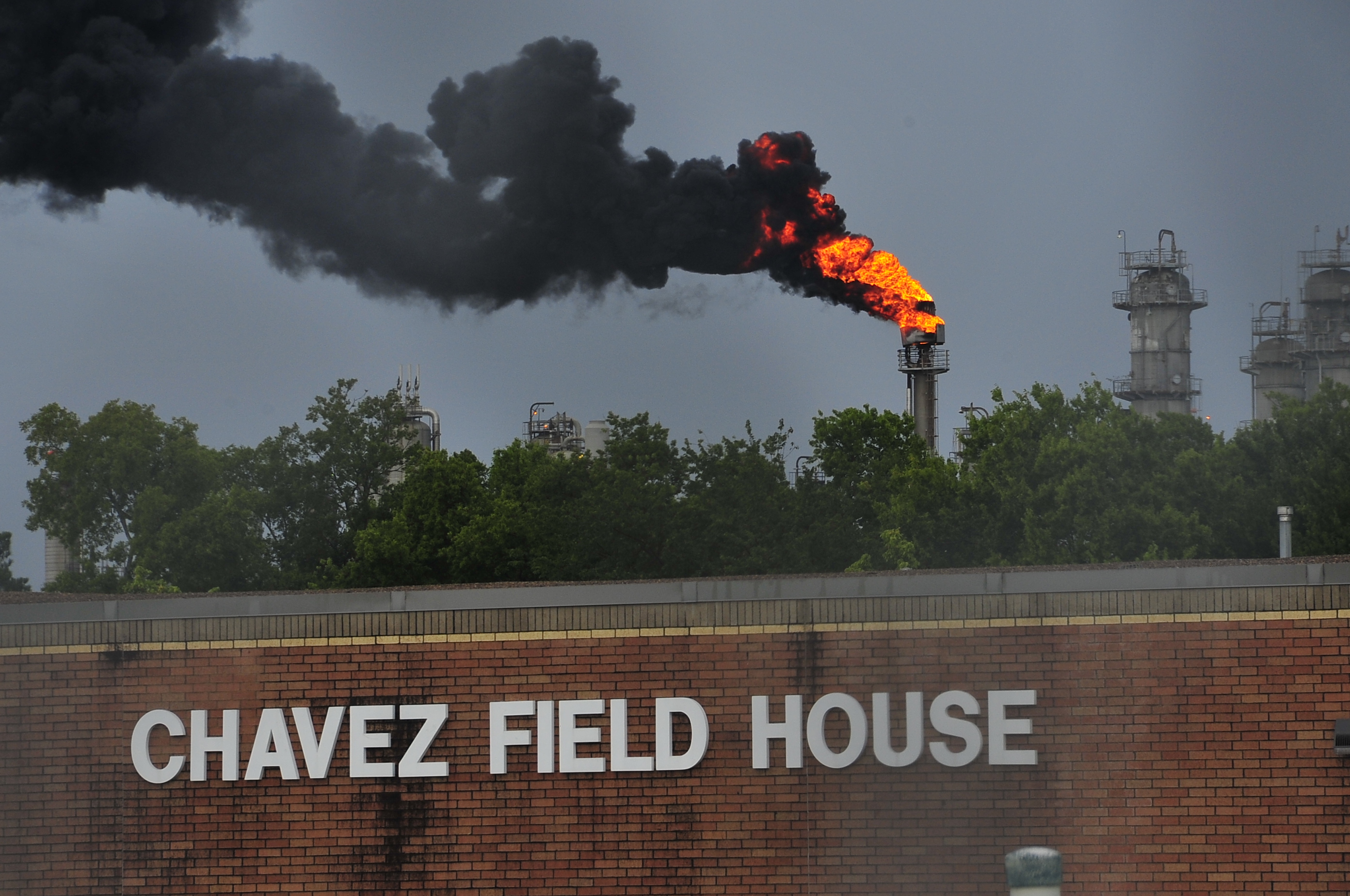 Flare from a petrochemical facility behind a school in East Houston