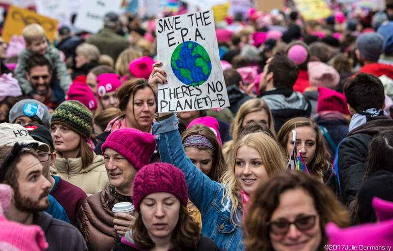 Woman holding a sign supporting the EPA at the Women's March on Washington.